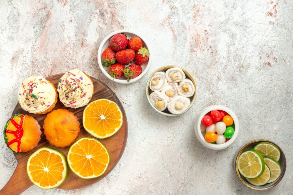 close-up view sweets and fruits in bowls