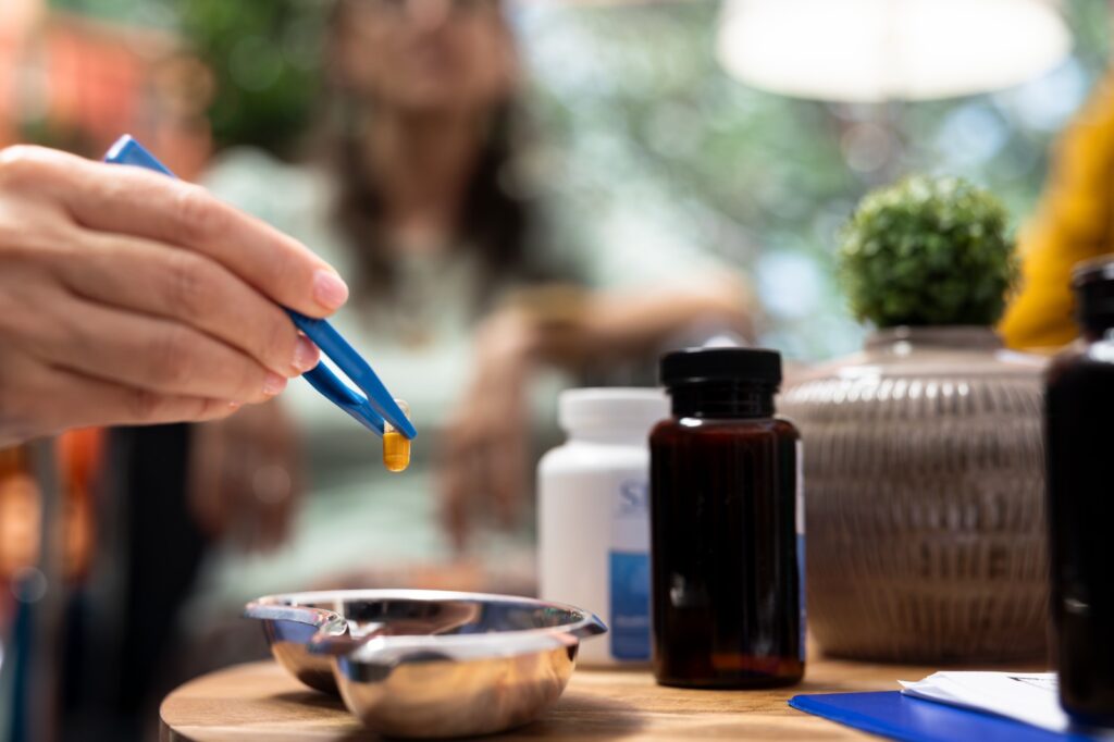 Social caregiver separating the medicaments and supplements pills